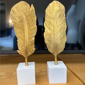 Gold Feather Sculptures on White Base